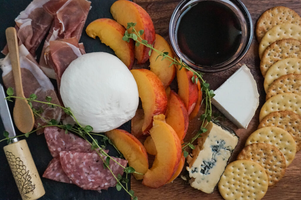 cheese board with peaches